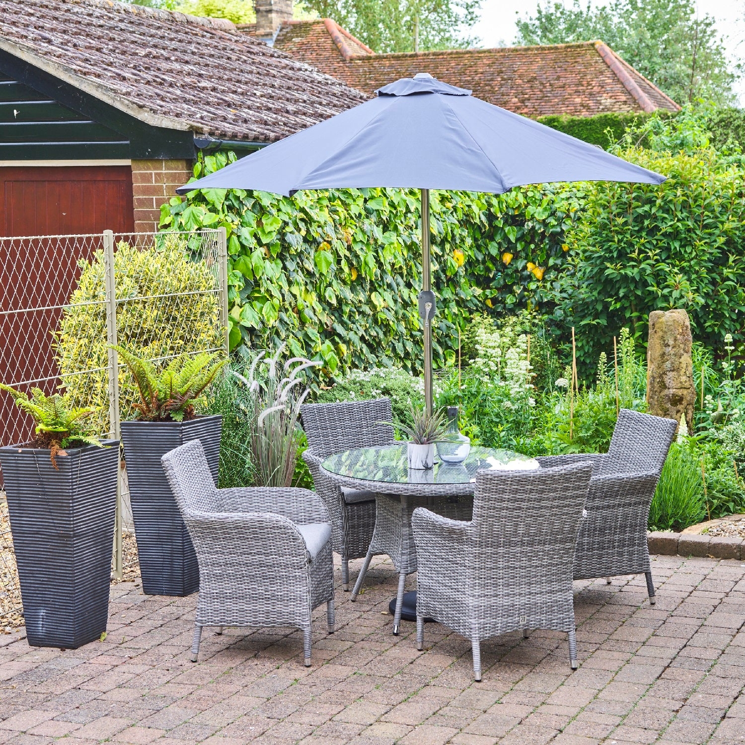 LG Outdoor Monaco Stone 4 Seat Dining Set with 2.5m Parasol Shop Skylark Garden Centre